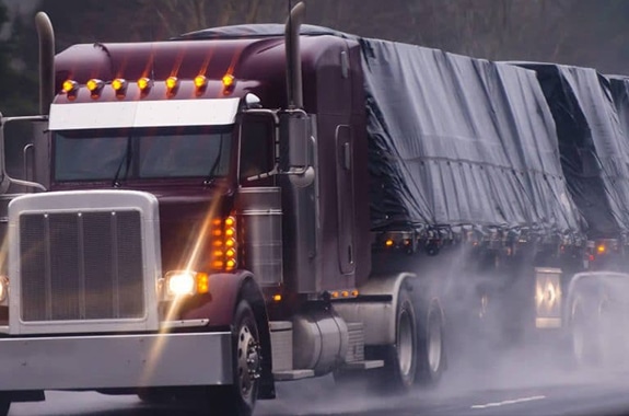 Truck with Roll Off System on Highway